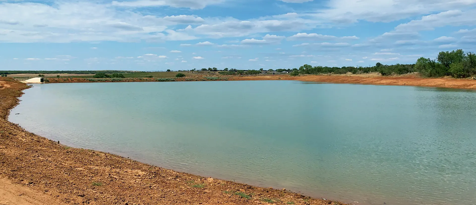 large-pond-in-texas-lonestar-minerals Large pond in Texas with a Bentonite Large Pond Liner from Lonestar Minerals