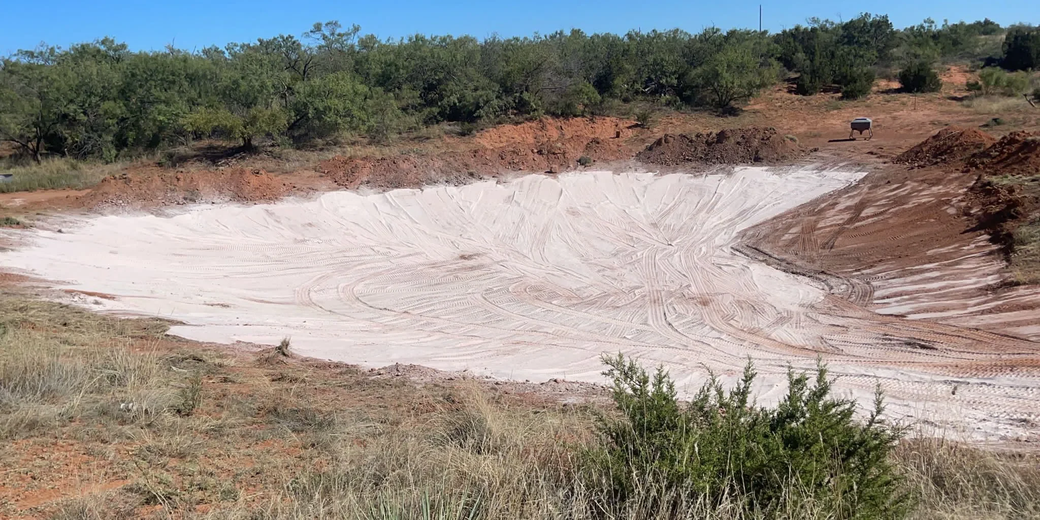 Line a pond with bentonite