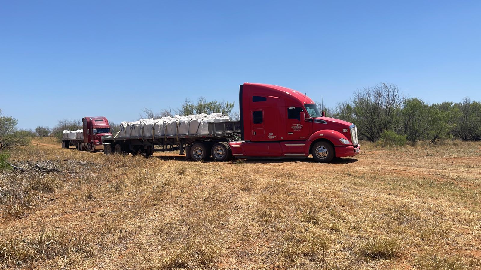 Full trucks transporting bentonite pond sealer Full trucks transporting bentonite pond sealer